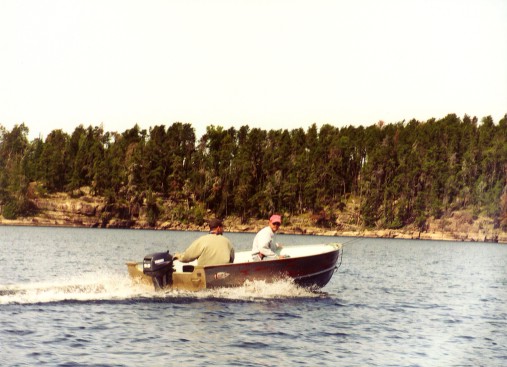Dan and Luke boating on White Otter Lake - image